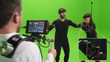 2 actors in motion capture suits with a HTC vive tracker highlighted